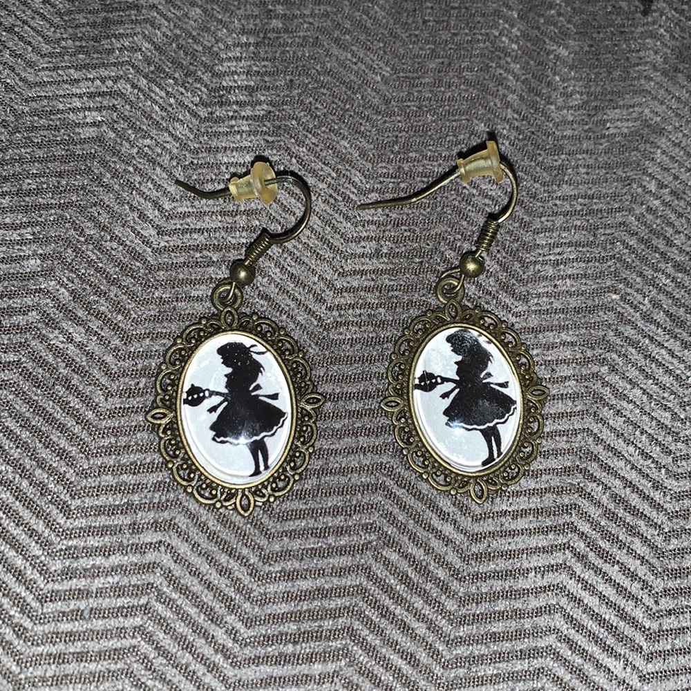 Alice with a teacup brassy earring